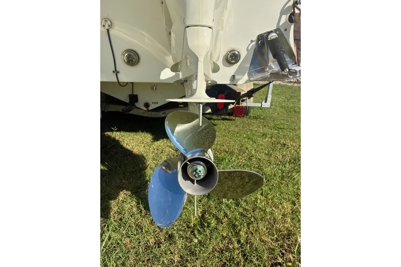 Slide: The Image of Rear view of a 2000 Cape Horn 27XS boat propeller on grass. - 25