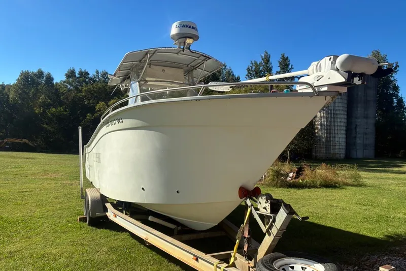 The Image of Cape Horn 27XS boat from 2000 on trailer, set in a grassy area. - 0