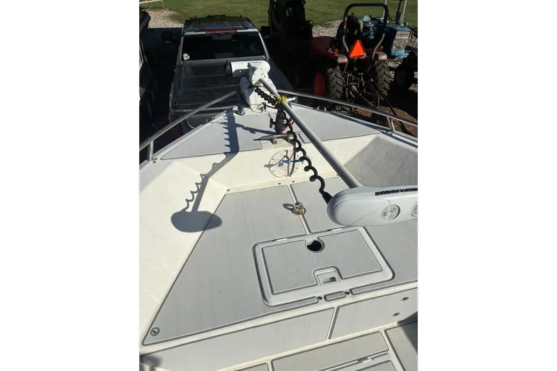 Slide: The Image of 2000 Cape Horn 27XS boat deck with mounted equipment, parked near vehicles. - 28
