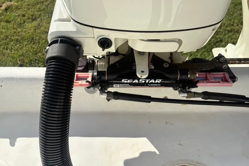 Slide: The Image of Close-up of SeaStar hydraulic steering system on a 2000 Cape Horn 27XS boat. - 23