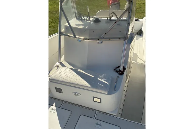 Slide: The Image of 2000 Cape Horn 27XS boat interior with seating and console, showcasing clean design. - 31