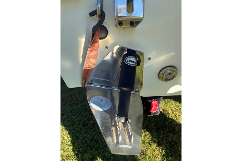 Slide: The Image of Cape Horn 27XS 2000 boat with Lenco trim tab and strap on grass. - 53