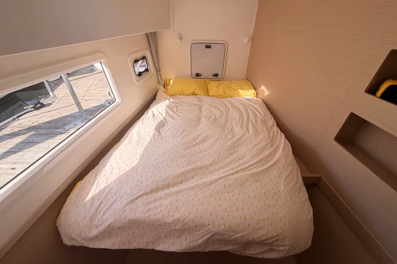 Slide: The Image of Cozy bedroom in 2020 Lagoon 42 catamaran with sunlight through window. - 71