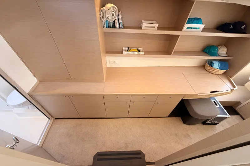 Slide: The Image of Modern interior of 2020 Lagoon 42 yacht with wooden cabinetry and shelving. - 83