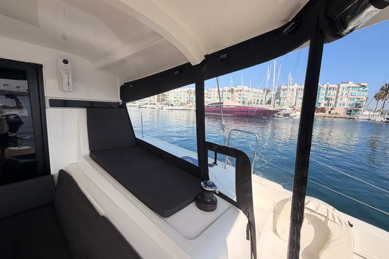Slide: The Image of Interior view of a 2020 Lagoon 42 catamaran docked at a marina. - 118