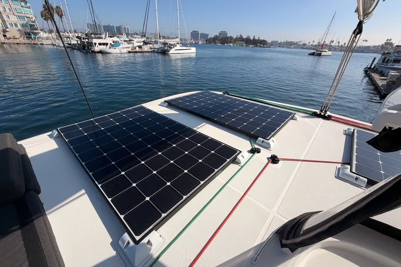 Slide: The Image of Solar panels on a 2020 Lagoon 42 catamaran docked in a marina. - 42