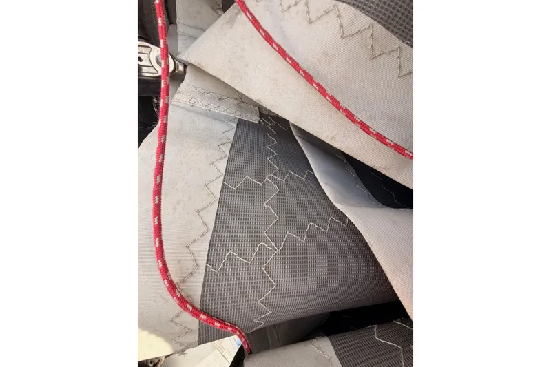 Slide: The Image of Close-up of Lagoon 42 sailboat sail fabric with red stitching, 2020 model. - 121