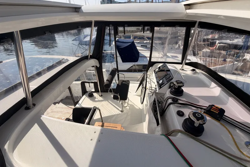 Slide: The Image of Cockpit view of a 2020 Lagoon 42 catamaran, showcasing helm and controls. - 46