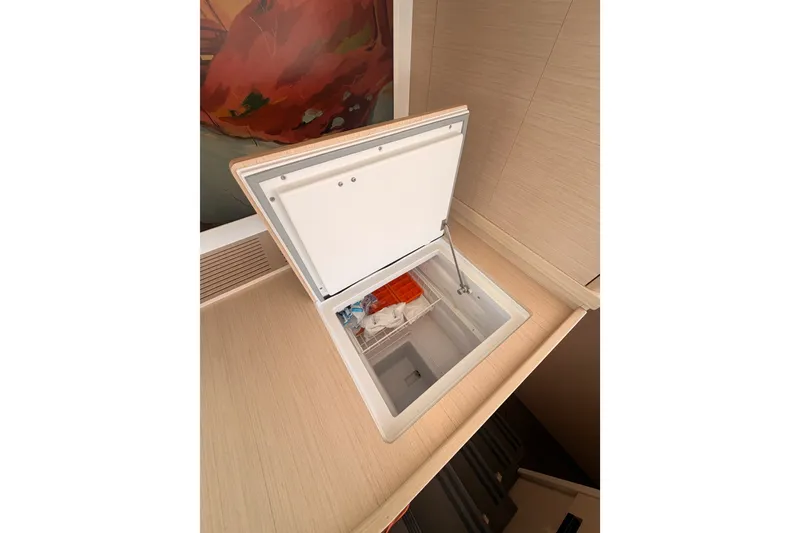 Slide: The Image of Open storage compartment on 2020 Lagoon 42 yacht, showcasing interior space and design. - 57
