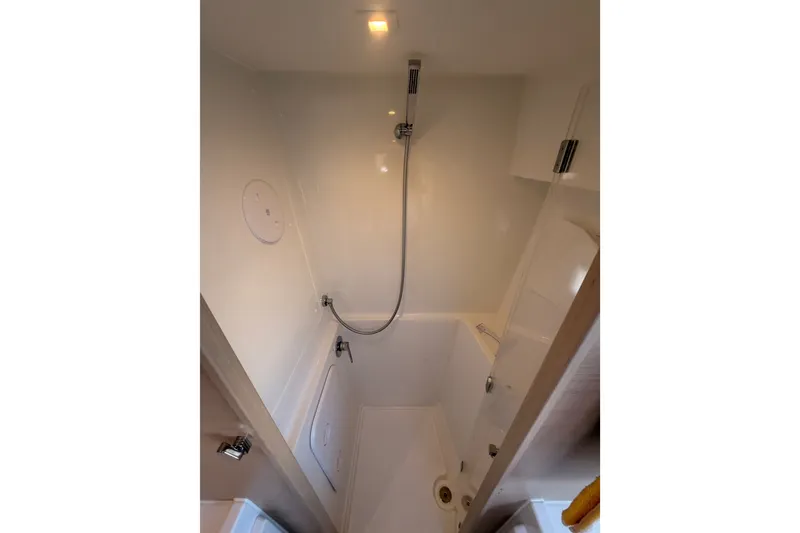 Slide: The Image of Shower area in 2020 Lagoon 42 catamaran, featuring modern fixtures and compact design. - 96