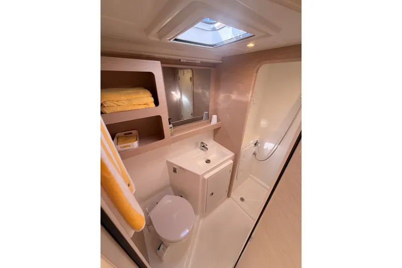 Slide: The Image of Modern bathroom in 2020 Lagoon 42 yacht with skylight, sink, and shower. - 65