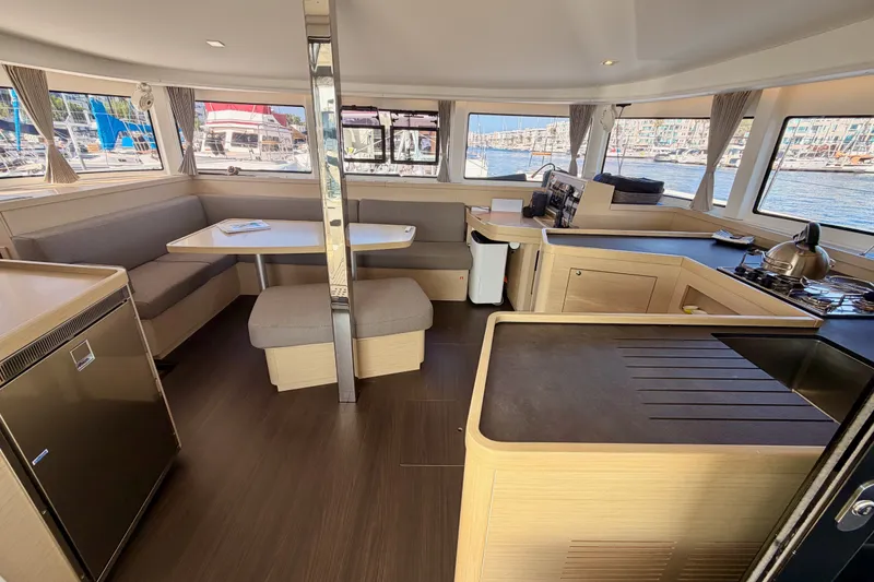 Slide: The Image of Interior of a 2020 Lagoon 42 catamaran with modern kitchen and dining area. - 50