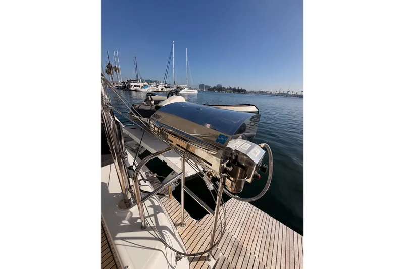 Slide: The Image of Docked Lagoon 42 catamaran, 2020 model, with stainless steel equipment, marina background. - 111