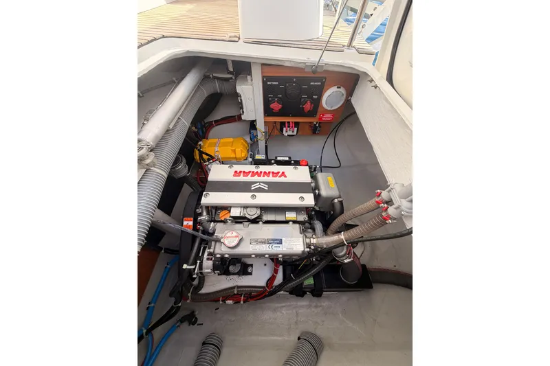 Slide: The Image of Engine compartment of a 2020 Lagoon 42 catamaran, featuring a Yanmar engine. - 110