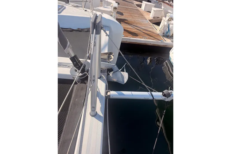 Slide: The Image of 2020 Lagoon 42 catamaran docked, showcasing deck and rigging details. - 18