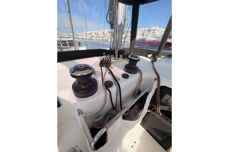Slide: The Image of Cockpit view of a 2020 Lagoon 42 sailboat with winches and ropes. - 39