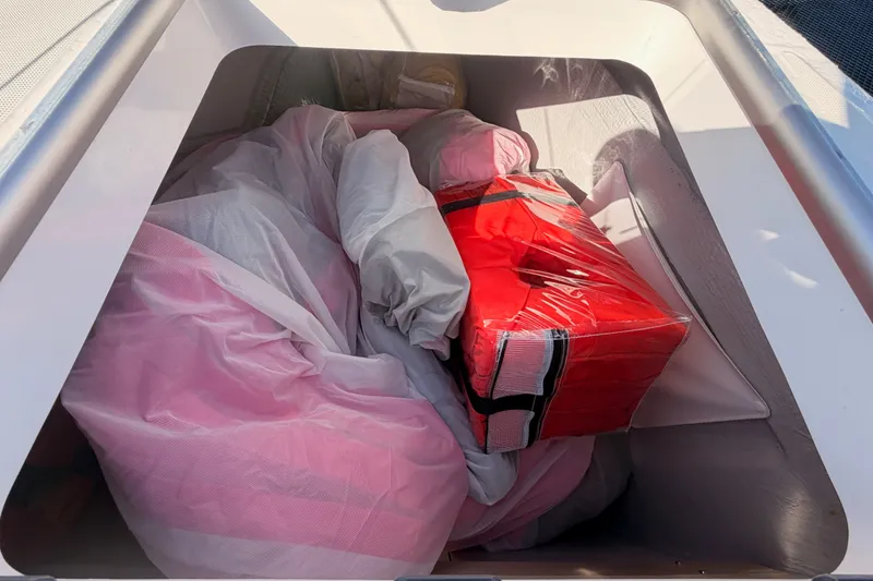 Slide: The Image of Storage compartment of a 2020 Lagoon 42 yacht with red and white gear. - 17
