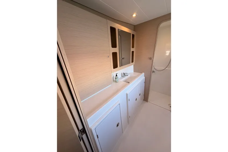 Slide: The Image of Modern bathroom interior of 2020 Lagoon 42 yacht with sleek cabinetry and shower. - 94