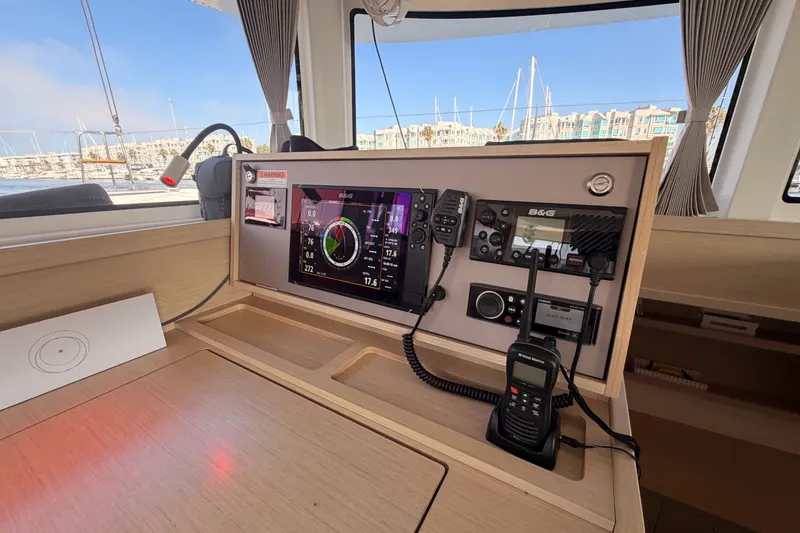 Slide: The Image of Control panel of a 2020 Lagoon 42 catamaran with navigation equipment. - 80