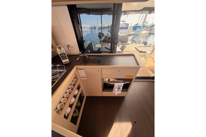 Slide: The Image of Modern kitchen interior of 2020 Lagoon 42 yacht with marina view. - 55