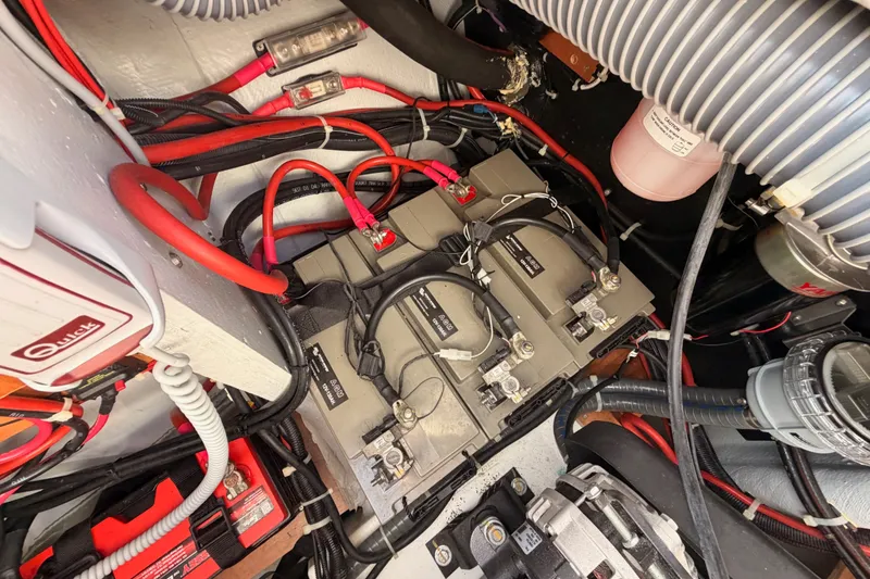 Slide: The Image of Battery compartment of a 2020 Lagoon 42 yacht with wiring and components. - 106