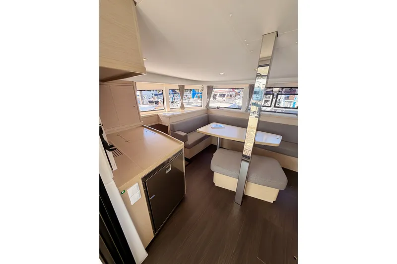 Slide: The Image of Interior of 2020 Lagoon 42 catamaran featuring modern kitchen and spacious seating area. - 51