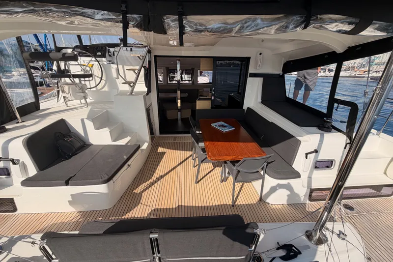 Slide: The Image of Spacious deck of 2020 Lagoon 42 catamaran with seating and dining area. - 30