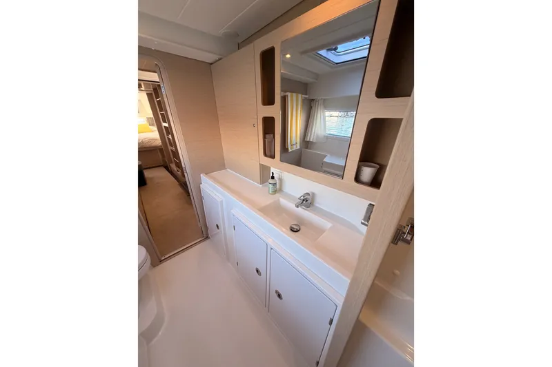 Slide: The Image of Modern bathroom interior of 2020 Lagoon 42 yacht, featuring sleek design and ample storage. - 98