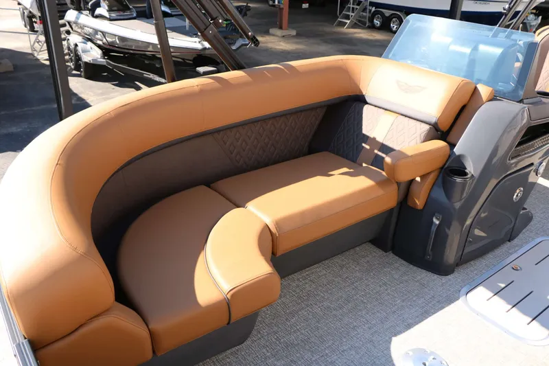 Slide: The Image of Luxurious curved seating with brown upholstery on a modern boat. - 37