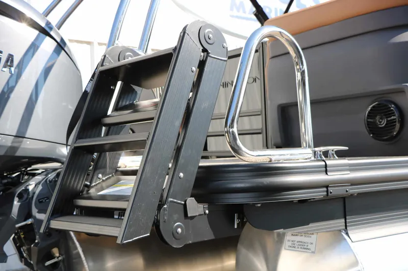 Slide: The Image of A swim ladder on a modern boat with stainless steel railing and gray accents. - 29