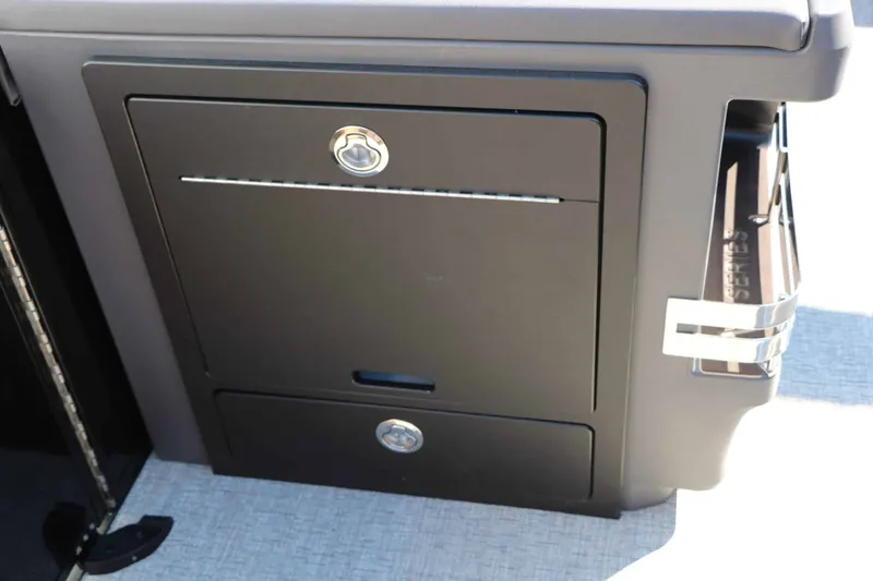 Slide: The Image of A sleek storage compartment with two sections and a cup holder on the side. - 45