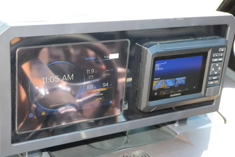 Slide: The Image of The image shows a modern dashboard with two digital displays, including a Garmin device. - 49