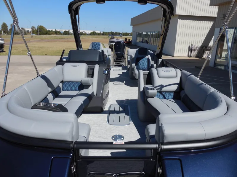 Slide: The Image of The image shows the interior of a 2027 Bennington 25 QXFBA with luxurious gray seating. - 16