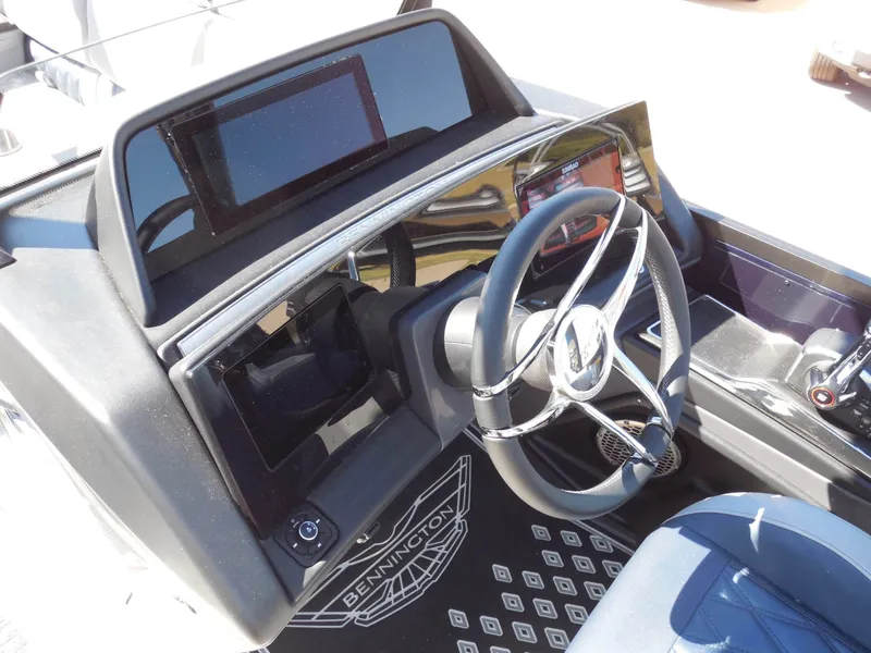 Slide: The Image of The image shows the cockpit of a 2027 Bennington 25 QXFBA with a modern helm station. - 21