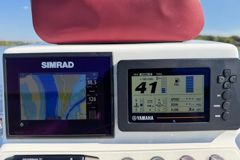 Slide: The Image of Dashboard of a 2019 Caribiana Maracas 23 Skiff with Simrad and Yamaha displays. - 8
