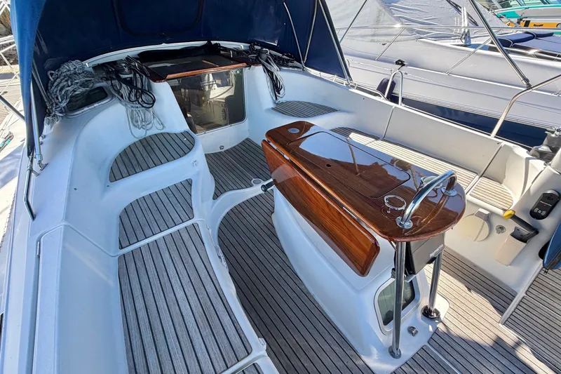 Slide: The Image of Cockpit of 2007 Jeanneau Sun Odyssey 42 DS sailboat with teak flooring and polished wood accents. - 3