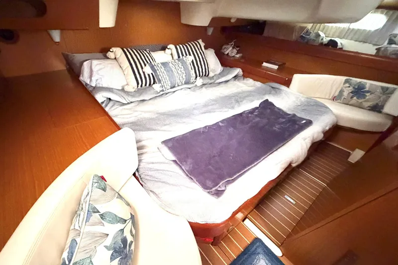 Slide: The Image of Cozy cabin interior of 2007 Jeanneau Sun Odyssey 42 DS with plush bedding and cushions. - 17