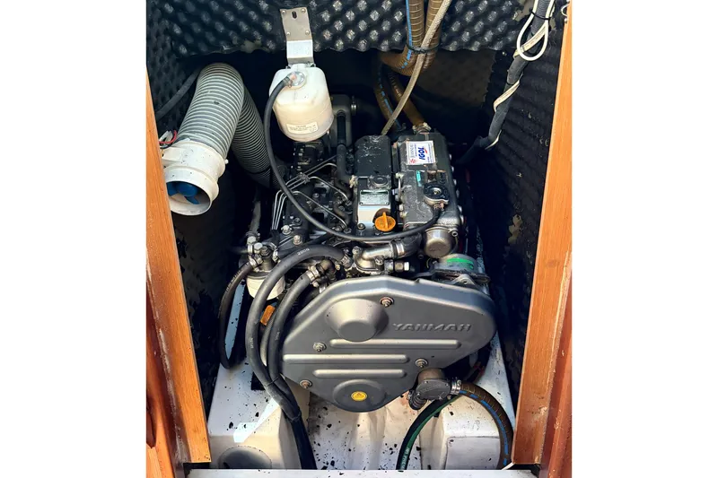 Slide: The Image of Engine compartment of a 2007 Jeanneau Sun Odyssey 42 DS sailboat, featuring a Yanmar engine. - 21