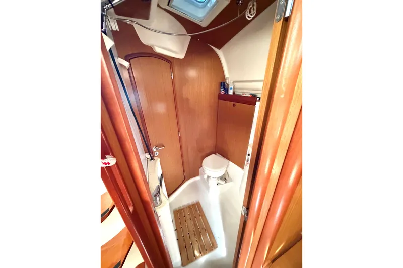 Slide: The Image of Bathroom interior of 2007 Jeanneau Sun Odyssey 42 DS sailboat, featuring wooden finishes. - 18