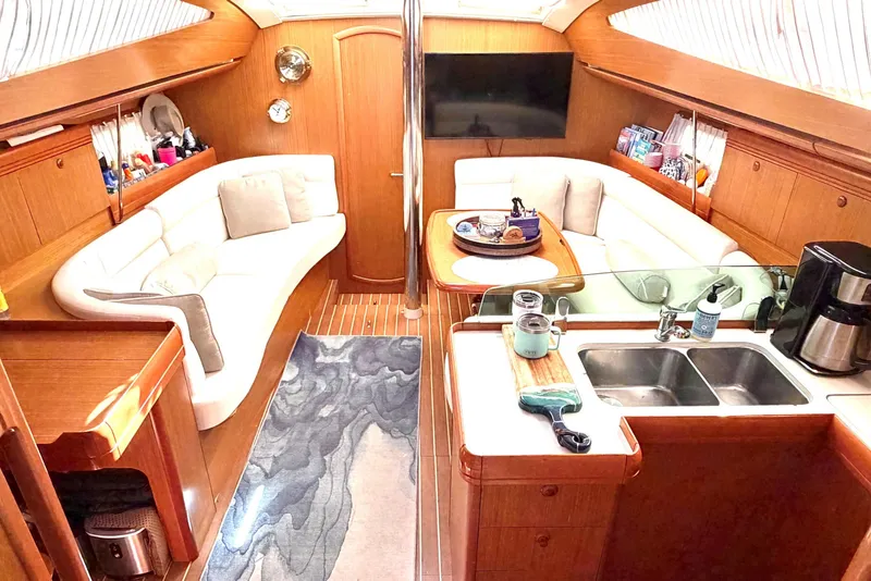 Slide: The Image of Luxurious interior of 2007 Jeanneau Sun Odyssey 42 DS yacht with cozy seating and modern amenities. - 11