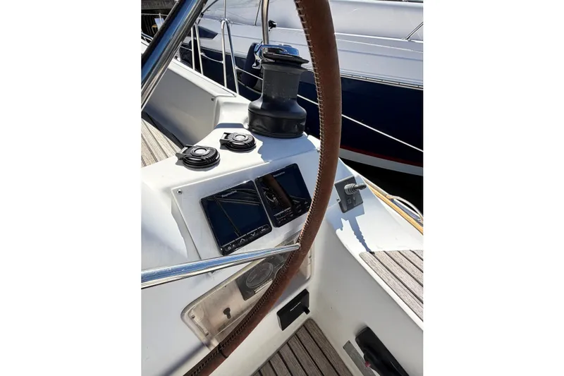 Slide: The Image of Cockpit of 2007 Jeanneau Sun Odyssey 42 DS sailboat with navigation instruments. - 8