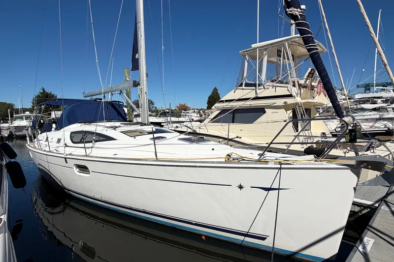 Slide: The Image of 2007 Jeanneau Sun Odyssey 42 DS sailboat docked at marina under clear blue sky. - 1