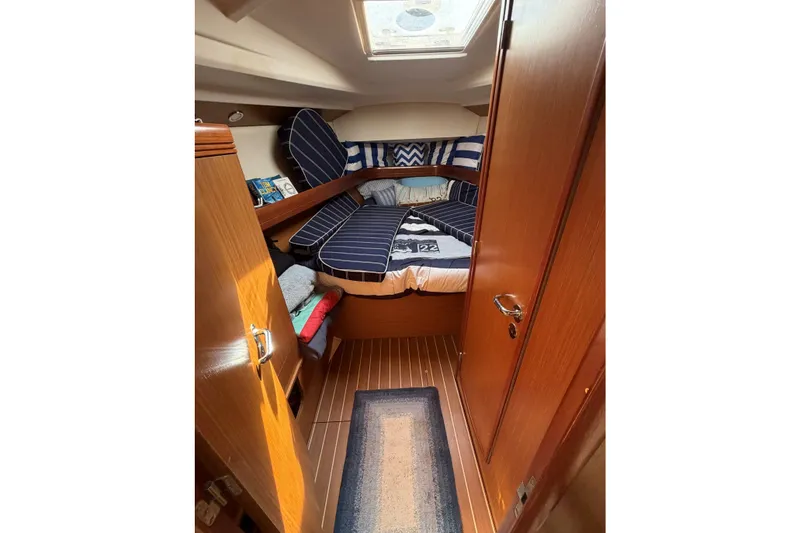 Slide: The Image of Cozy cabin interior of 2007 Jeanneau Sun Odyssey 42 DS with nautical decor. - 16