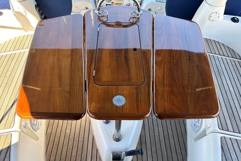 Slide: The Image of Polished wooden cockpit table on 2007 Jeanneau Sun Odyssey 42 DS sailboat. - 4