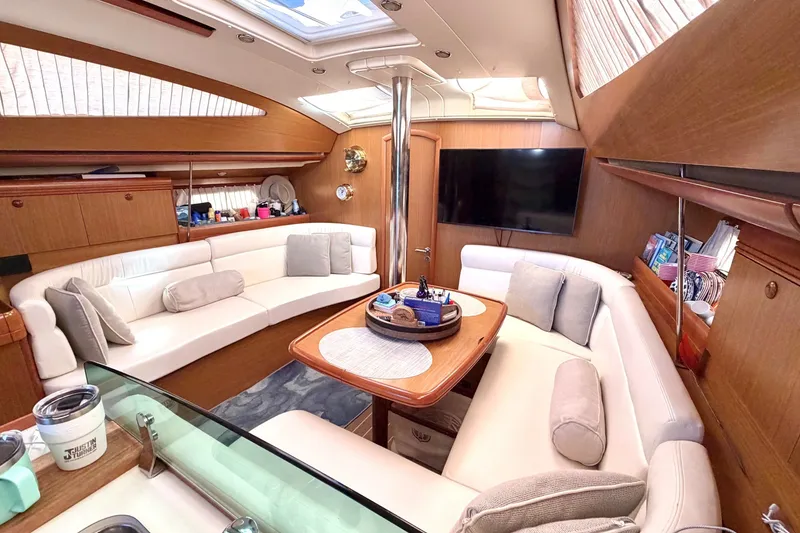 Slide: The Image of Luxurious interior of 2007 Jeanneau Sun Odyssey 42 DS yacht with elegant seating and modern amenities. - 10