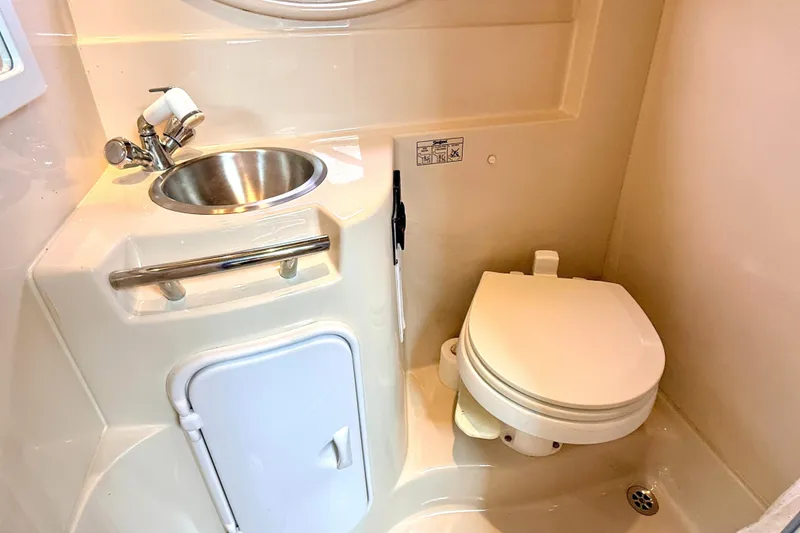 Slide: The Image of 2009 Four Winns 278 Vista boat bathroom with sink and toilet. - 28