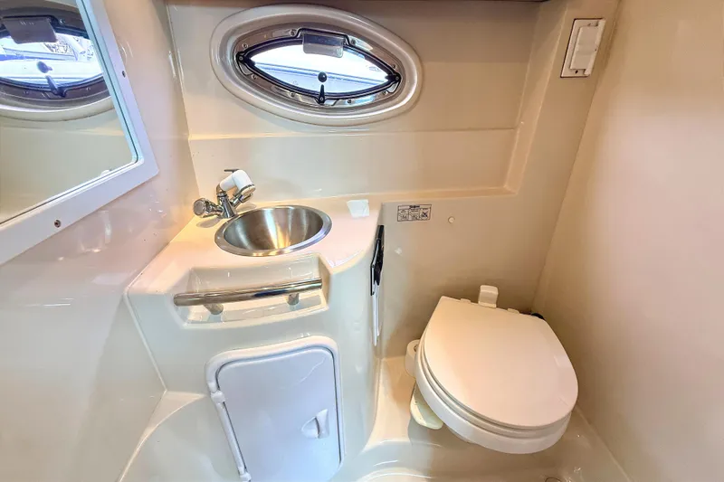Slide: The Image of Compact bathroom in 2009 Four Winns 278 Vista boat with sink and toilet. - 26