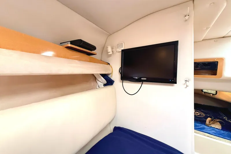 Slide: The Image of Interior of 2009 Four Winns 278 Vista boat with TV and shelving. - 25