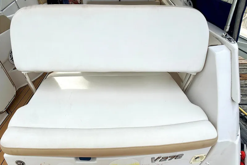 Slide: The Image of 2009 Four Winns 278 Vista boat seating area with white cushions and teak flooring. - 18