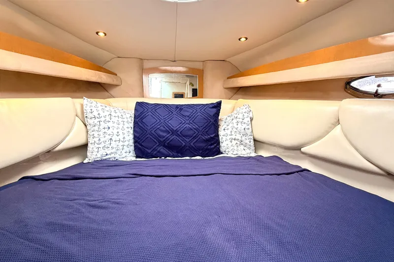 Slide: The Image of Interior cabin of 2009 Four Winns 278 Vista with cozy bedding and ambient lighting. - 22